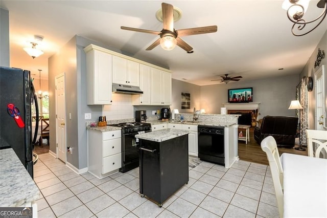 2759 Beddington Way, Suwanee, GA 30024 - kitchen with black appliances, under cabinet range hood, ceiling fan, a peninsula, and open floor plan