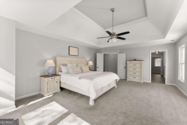 3498 Westhampton Way, Gainesville, GA 30506 - bedroom featuring a tray ceiling, ceiling fan, light carpet, and baseboards