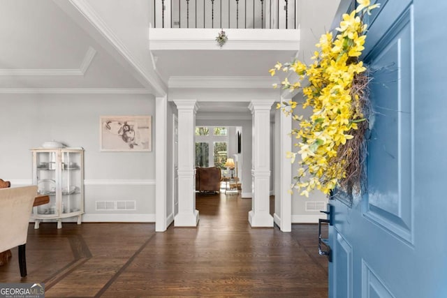 3498 Westhampton Way, Gainesville, GA 30506 - foyer with wood finished floors, ornate columns, crown molding, visible vents, and baseboards