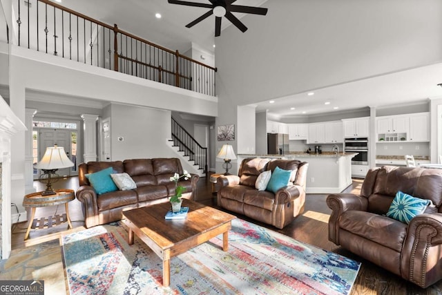 3498 Westhampton Way, Gainesville, GA 30506 - living area featuring a towering ceiling, recessed lighting, stairway, crown molding, and a ceiling fan