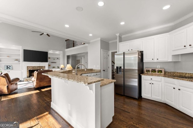 3498 Westhampton Way, Gainesville, GA 30506 - kitchen featuring crown molding, light stone counters, stainless steel refrigerator with ice dispenser, and recessed lighting