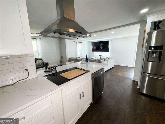 2638 Cleburne Pkwy, Powder Springs, GA 30127 - kitchen with dishwashing machine, wall chimney exhaust hood, white cabinetry, stainless steel fridge, and black electric cooktop