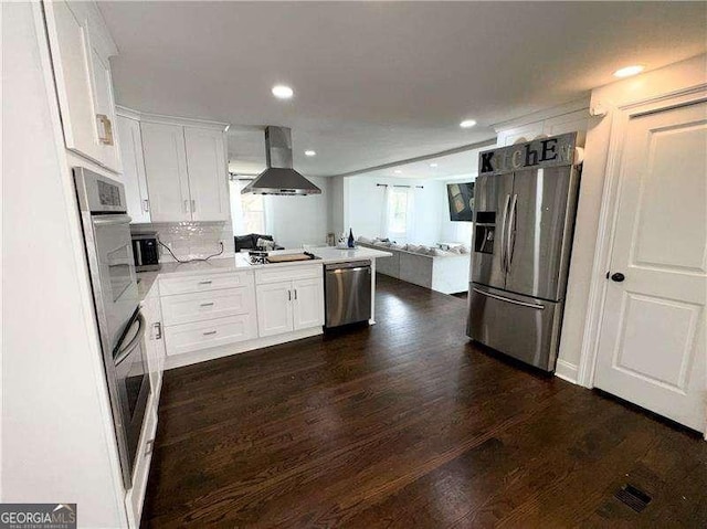2638 Cleburne Pkwy, Powder Springs, GA 30127 - kitchen with stainless steel appliances, open floor plan, extractor fan, white cabinetry, and dark wood-type flooring