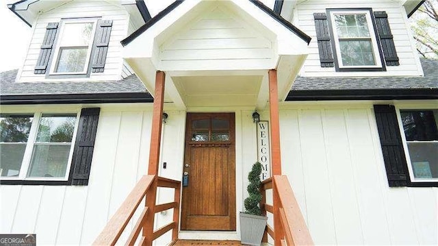 2638 Cleburne Pkwy, Powder Springs, GA 30127 - doorway to property with board and batten siding and roof with shingles