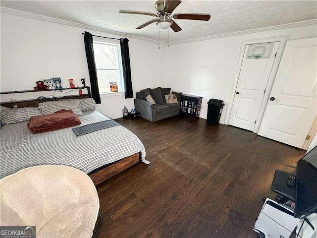 2638 Cleburne Pkwy, Powder Springs, GA 30127 - bedroom featuring ornamental molding, a textured ceiling, and wood finished floors