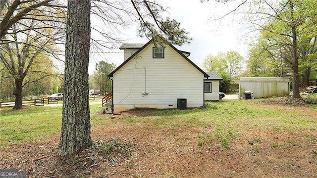 2638 Cleburne Pkwy, Powder Springs, GA 30127 - view of side of property with a yard, fence, central AC unit, and crawl space