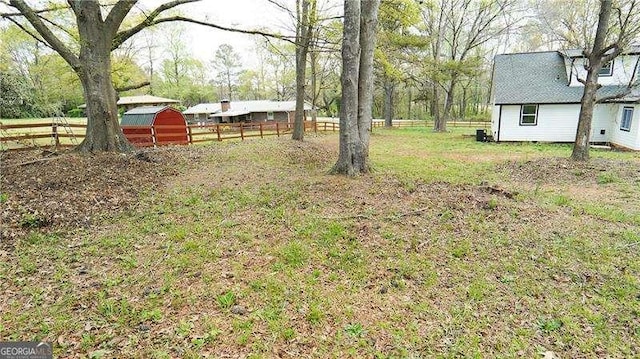 2638 Cleburne Pkwy, Powder Springs, GA 30127 - view of yard featuring a storage shed, an outdoor structure, and fence