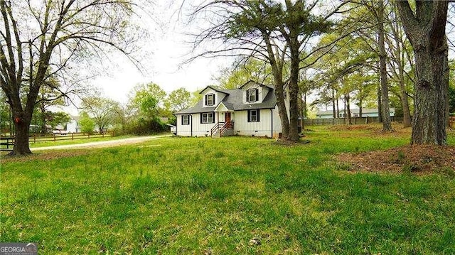 2638 Cleburne Pkwy, Powder Springs, GA 30127 - cape cod home featuring fence and a front yard