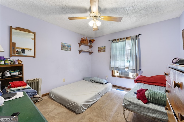4720 Bill Cheek Rd, Auburn, GA 30011 - carpeted bedroom featuring a textured ceiling, radiator, and a ceiling fan