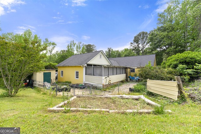 4720 Bill Cheek Rd, Auburn, GA 30011 - exterior space with an outbuilding, a shed, a sunroom, and fence