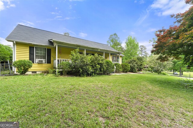 4720 Bill Cheek Rd, Auburn, GA 30011 - view of front facade with a front lawn, covered porch, and fence