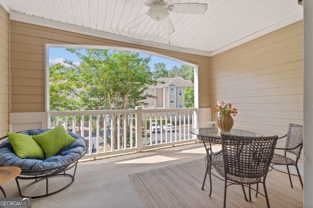 balcony with a ceiling fan and outdoor dining area
