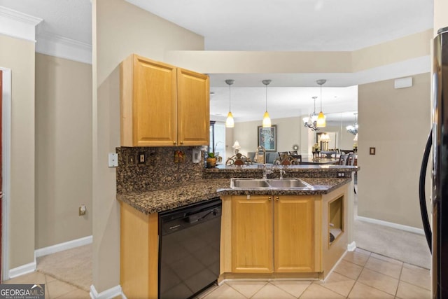 kitchen with black appliances, a sink, light tile patterned floors, a peninsula, and decorative light fixtures