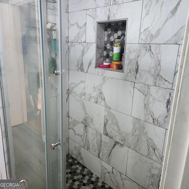 bathroom featuring a shower stall