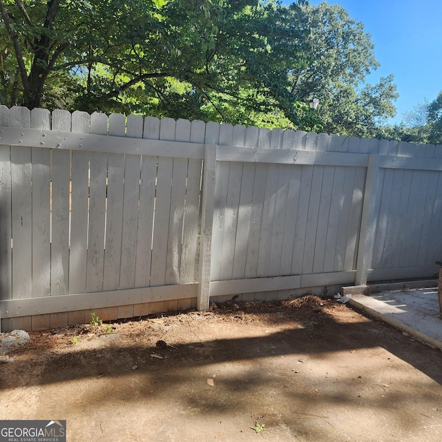 view of gate with fence