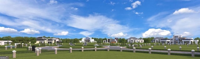 view of home's community with fence and a lawn