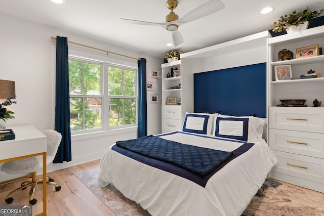 bedroom with recessed lighting, ceiling fan, and light wood-type flooring