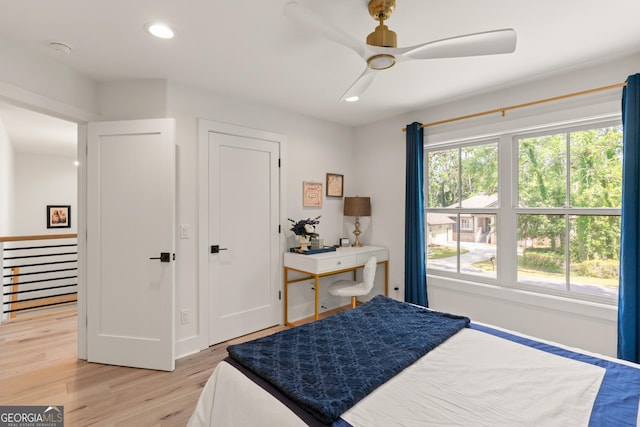 bedroom featuring light wood finished floors, baseboards, ceiling fan, and recessed lighting