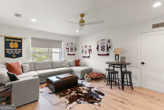 living area with visible vents, wood finished floors, ceiling fan, and recessed lighting
