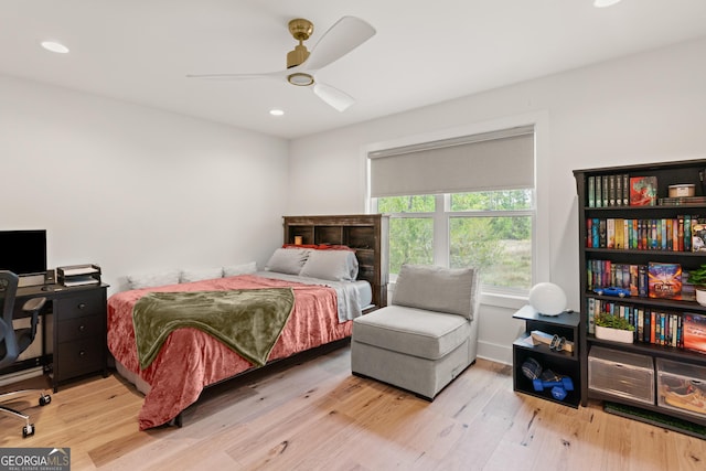 bedroom featuring ceiling fan, wood finished floors, and recessed lighting