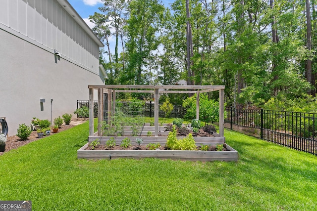 view of yard with fence private yard and a garden