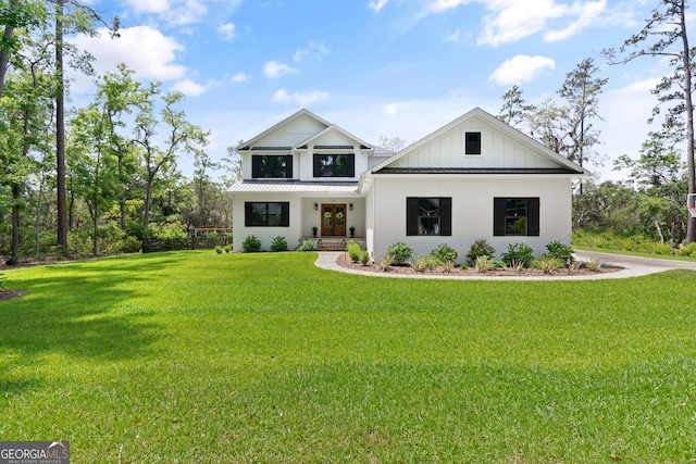 modern farmhouse with french doors and a front yard