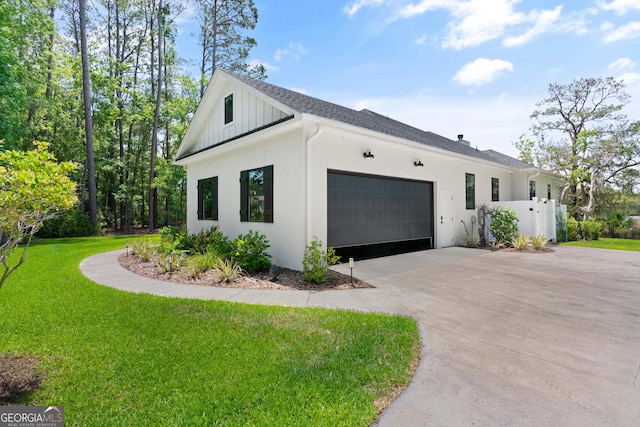 view of home's exterior featuring fence, an attached garage, driveway, a yard, and a shingled roof