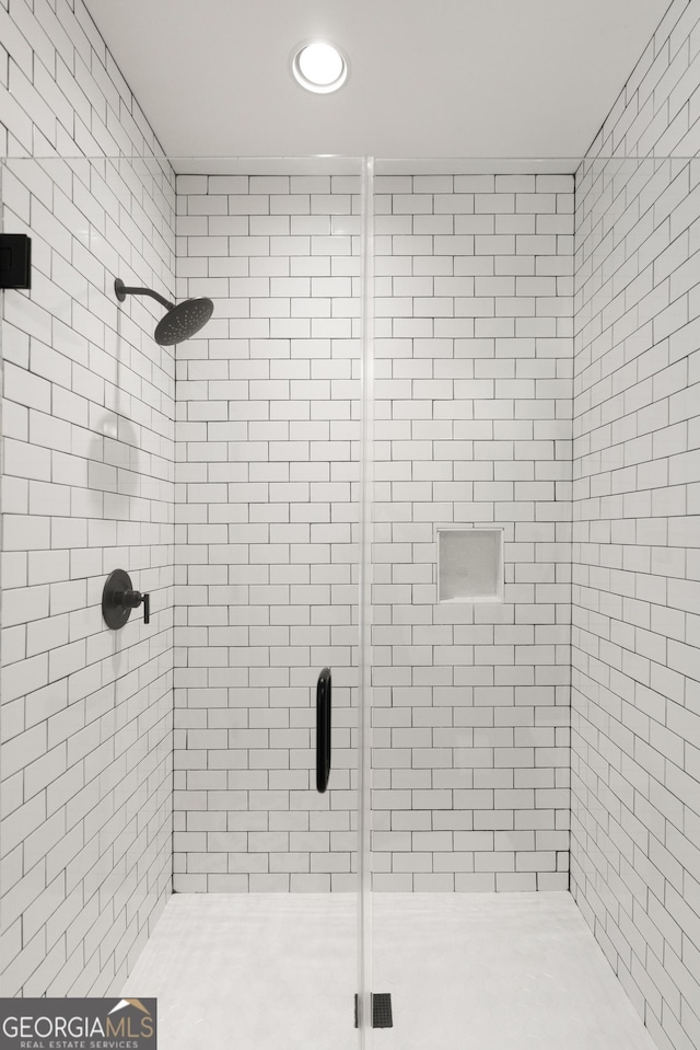 full bathroom with a shower stall and recessed lighting