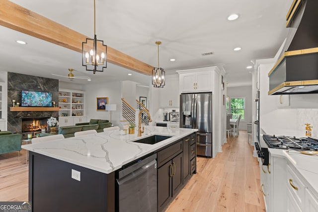 kitchen featuring recessed lighting, visible vents, a sink, stainless steel appliances, and white cabinets