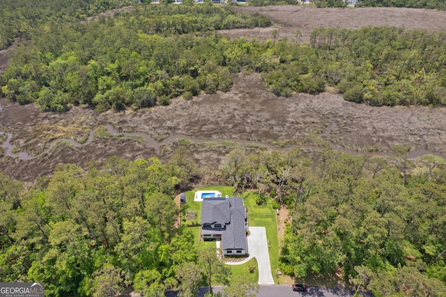 bird's eye view featuring a view of trees