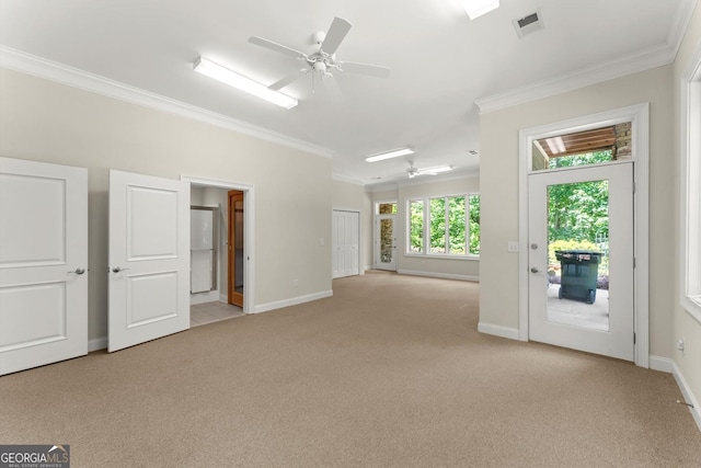 unfurnished living room with crown molding, light colored carpet, ceiling fan, and baseboards