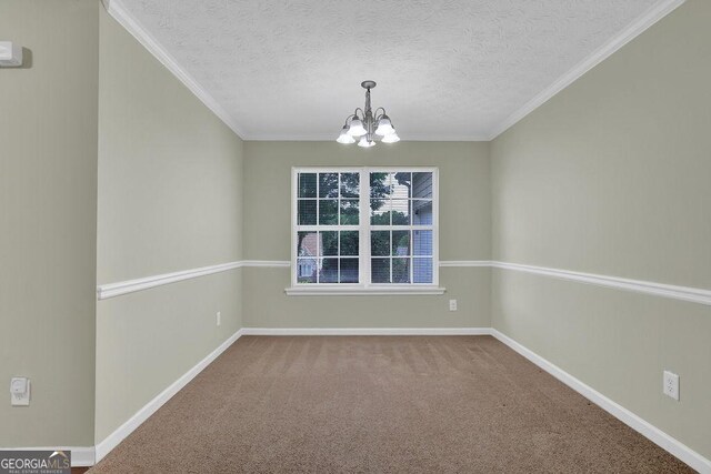 6345 Aarons Way, Flowery Branch, GA 30542 - unfurnished dining area with baseboards, a notable chandelier, crown molding, and carpet floors