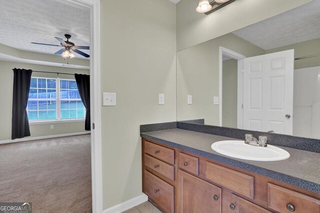 6345 Aarons Way, Flowery Branch, GA 30542 - bathroom with baseboards, vanity, and ceiling fan