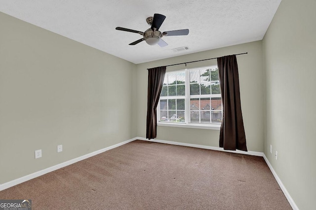 6345 Aarons Way, Flowery Branch, GA 30542 - carpeted spare room featuring a textured ceiling, visible vents, baseboards, and a ceiling fan