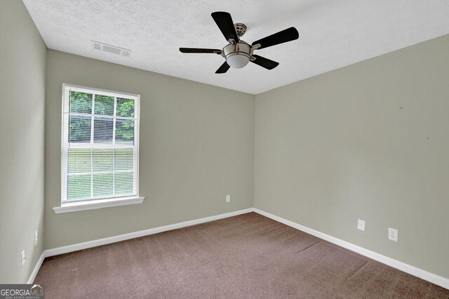 6345 Aarons Way, Flowery Branch, GA 30542 - carpeted spare room featuring a ceiling fan, baseboards, and visible vents
