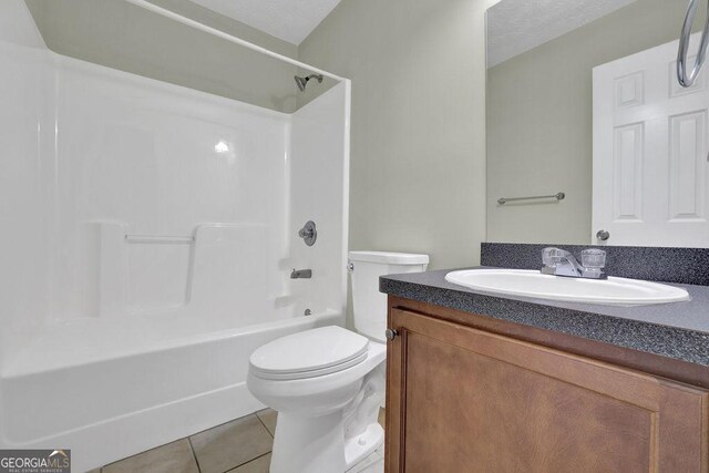 6345 Aarons Way, Flowery Branch, GA 30542 - bathroom with toilet, shower / bath combination, tile patterned floors, and vanity