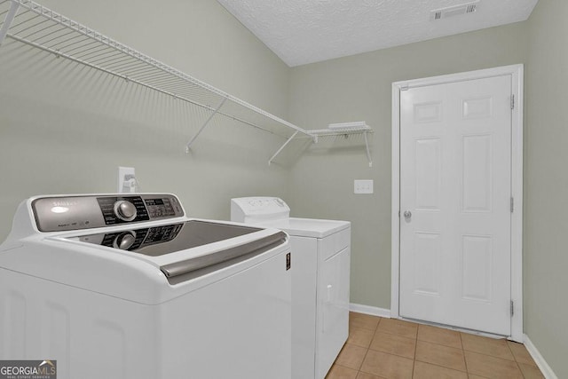 6345 Aarons Way, Flowery Branch, GA 30542 - washroom with laundry area, light tile patterned flooring, visible vents, separate washer and dryer, and baseboards