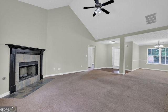 6345 Aarons Way, Flowery Branch, GA 30542 - unfurnished living room featuring a tiled fireplace, carpet flooring, ceiling fan with notable chandelier, and visible vents