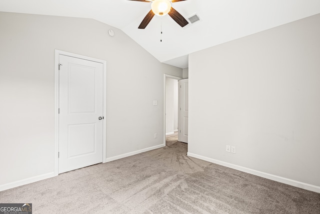 126 Ashton Pl, Newnan, GA 30265 - unfurnished bedroom with a ceiling fan, baseboards, visible vents, vaulted ceiling, and carpet floors