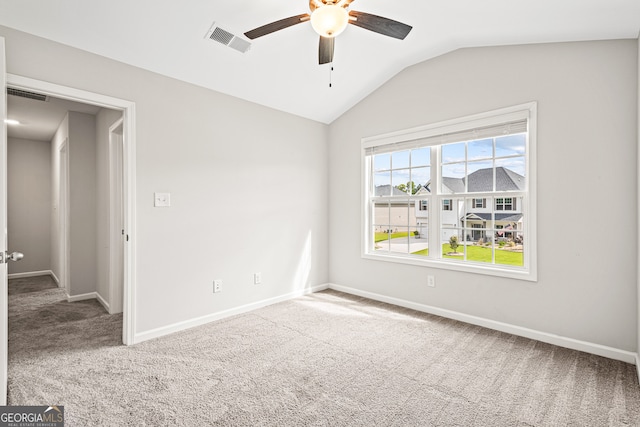 126 Ashton Pl, Newnan, GA 30265 - spare room with vaulted ceiling, ceiling fan, carpet floors, and visible vents