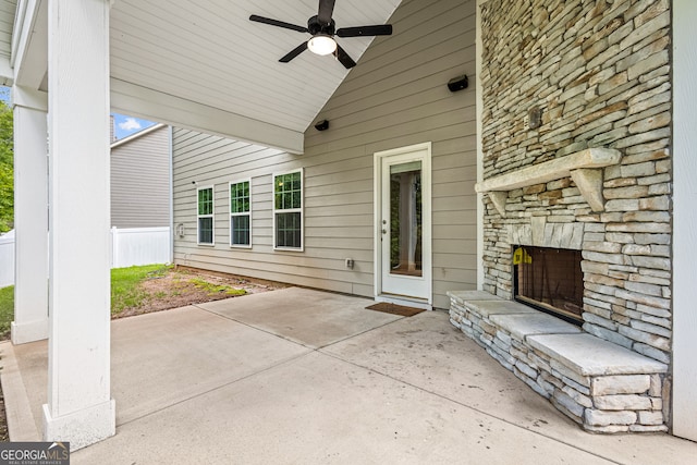 126 Ashton Pl, Newnan, GA 30265 - view of patio with a ceiling fan and an outdoor stone fireplace