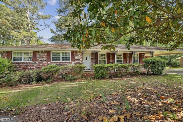 4074 Idlevale Dr, Tucker, GA 30084 - ranch-style house with brick siding and an attached carport