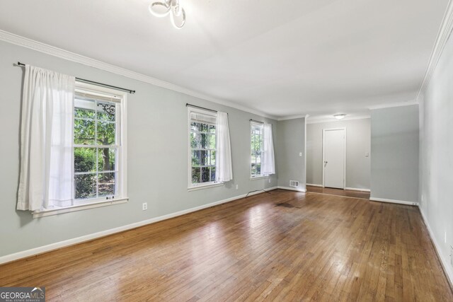 4074 Idlevale Dr, Tucker, GA 30084 - unfurnished room with crown molding, visible vents, baseboards, and hardwood / wood-style floors