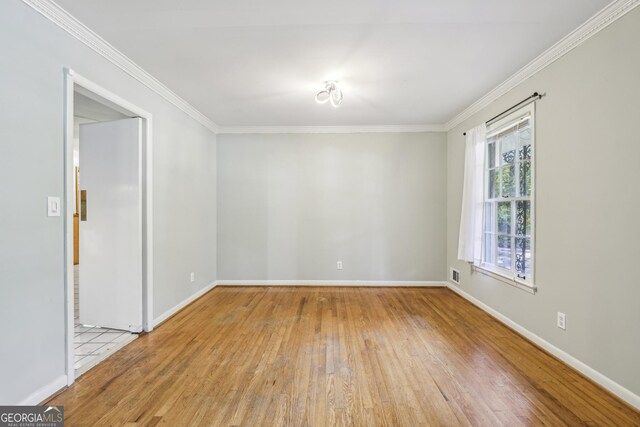 4074 Idlevale Dr, Tucker, GA 30084 - unfurnished room with crown molding, wood-type flooring, baseboards, and visible vents