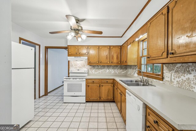 4074 Idlevale Dr, Tucker, GA 30084 - kitchen with a ceiling fan, white appliances, a sink, brown cabinets, and tasteful backsplash