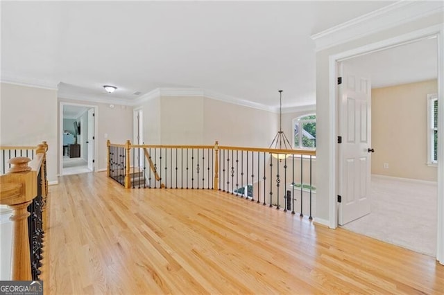 bonus room featuring wood finished floors and baseboards