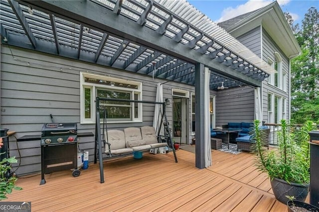 wooden terrace featuring a pergola and an outdoor hangout area