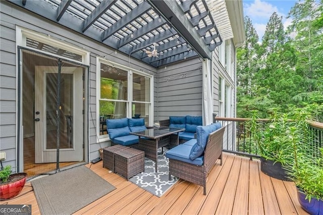 deck featuring a pergola and an outdoor hangout area