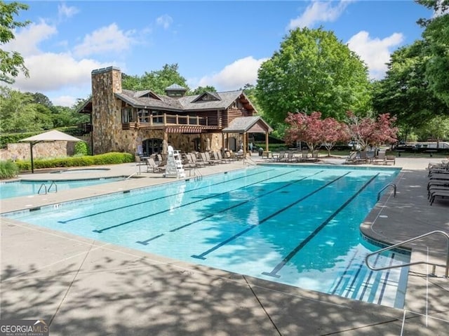 community pool featuring a patio area