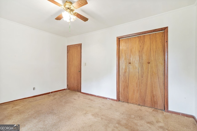 119 Blount St, Forsyth, GA 31029 - unfurnished bedroom featuring carpet, ornamental molding, ceiling fan, and a closet